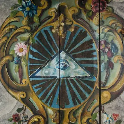 Tafelbild - ein Auge Gottes mit Lichtstraheln und Blumenkranz auf Holz gemalt.