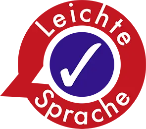 Logo rote Sprechblase mit der Aufschrift Leichte Sprache. In der Mitte ein weißer Haken auf violettem Hintergrund.