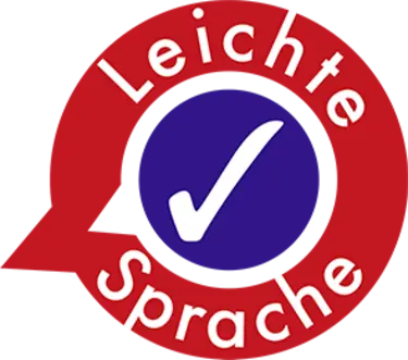 Logo rote Sprechblase mit der Aufschrift Leichte Sprache. In der Mitte ein weißer Haken auf violettem Hintergrund.